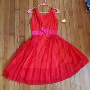 Red silky retro 1950s swing cocktail dress with pink waistband